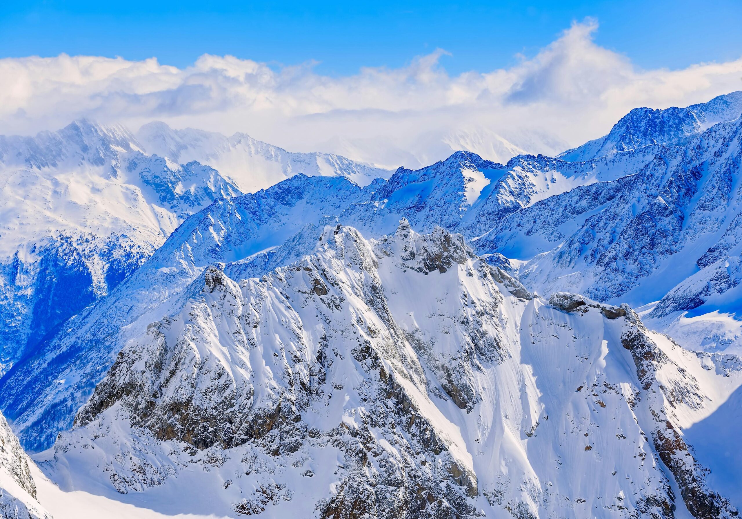 Stunning view of snow-covered peaks in Engelberg, Switzerland. Perfect for winter adventures.